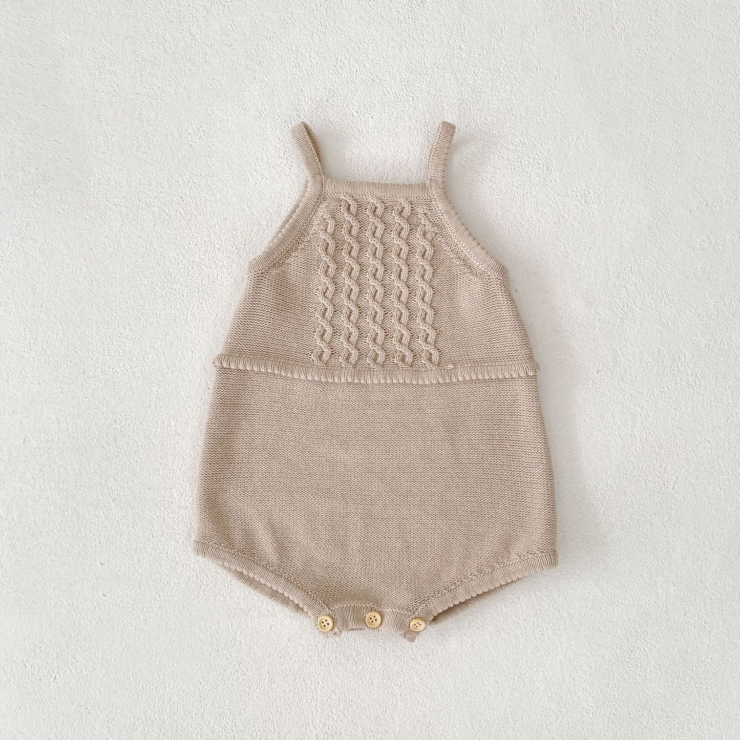 Acorn Cable Romper flat lay