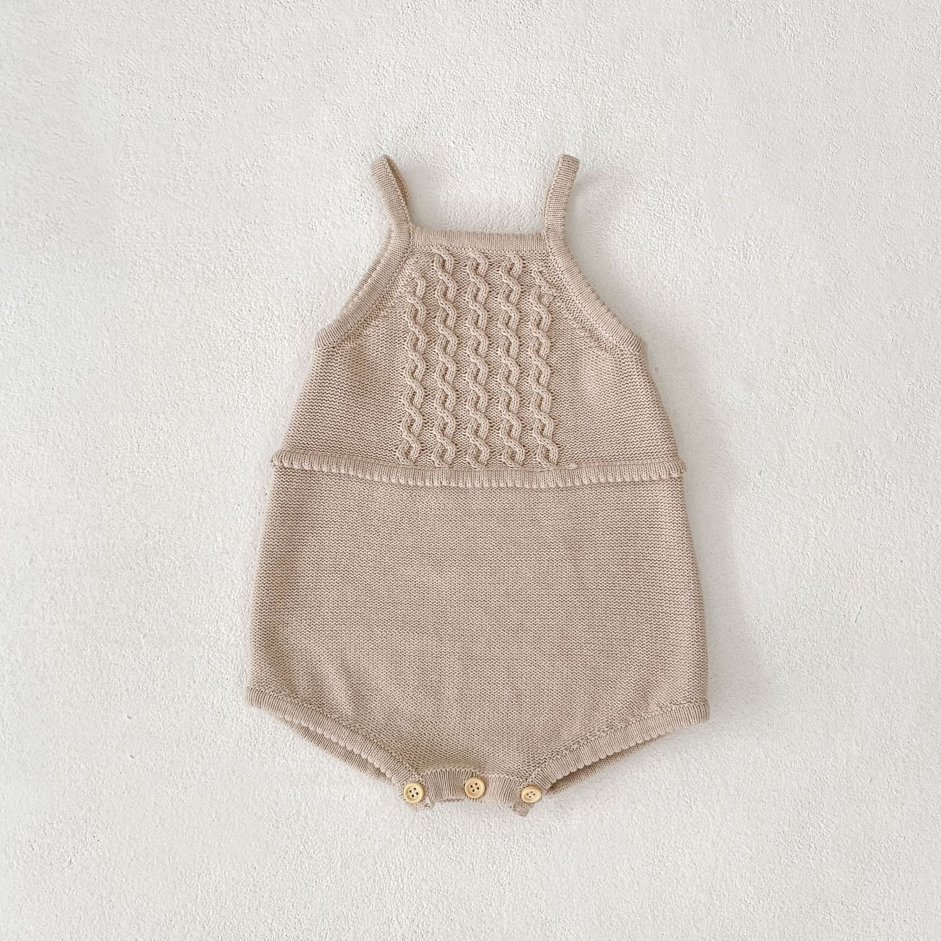 Acorn Cable Romper flat lay
