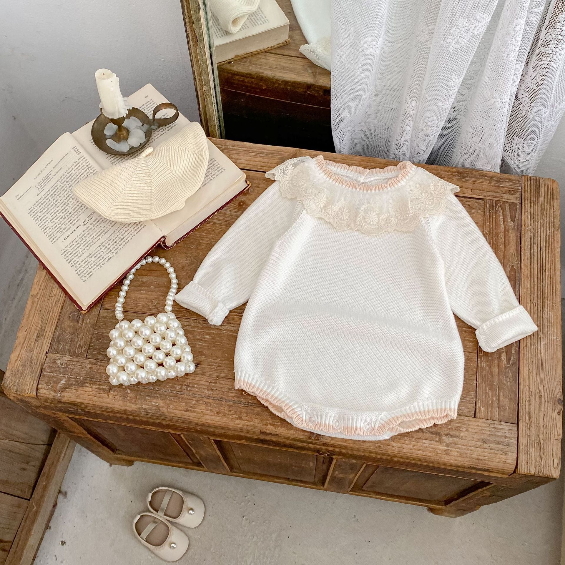 Meadow Lace Romper styled on table