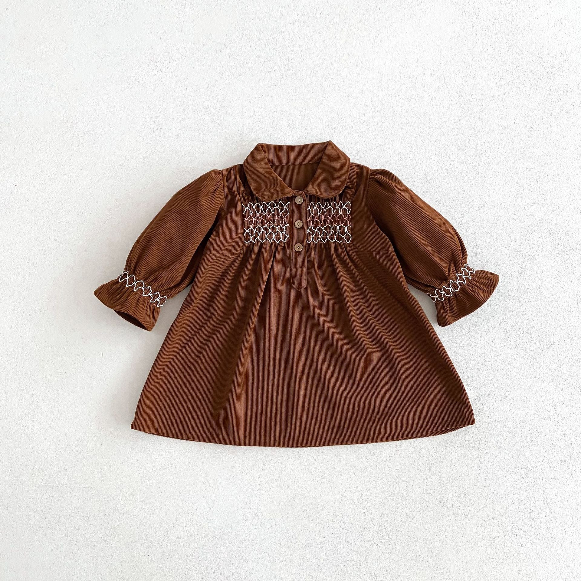 Acorn Smocked Dress in Chocolate corduroy, flat lay